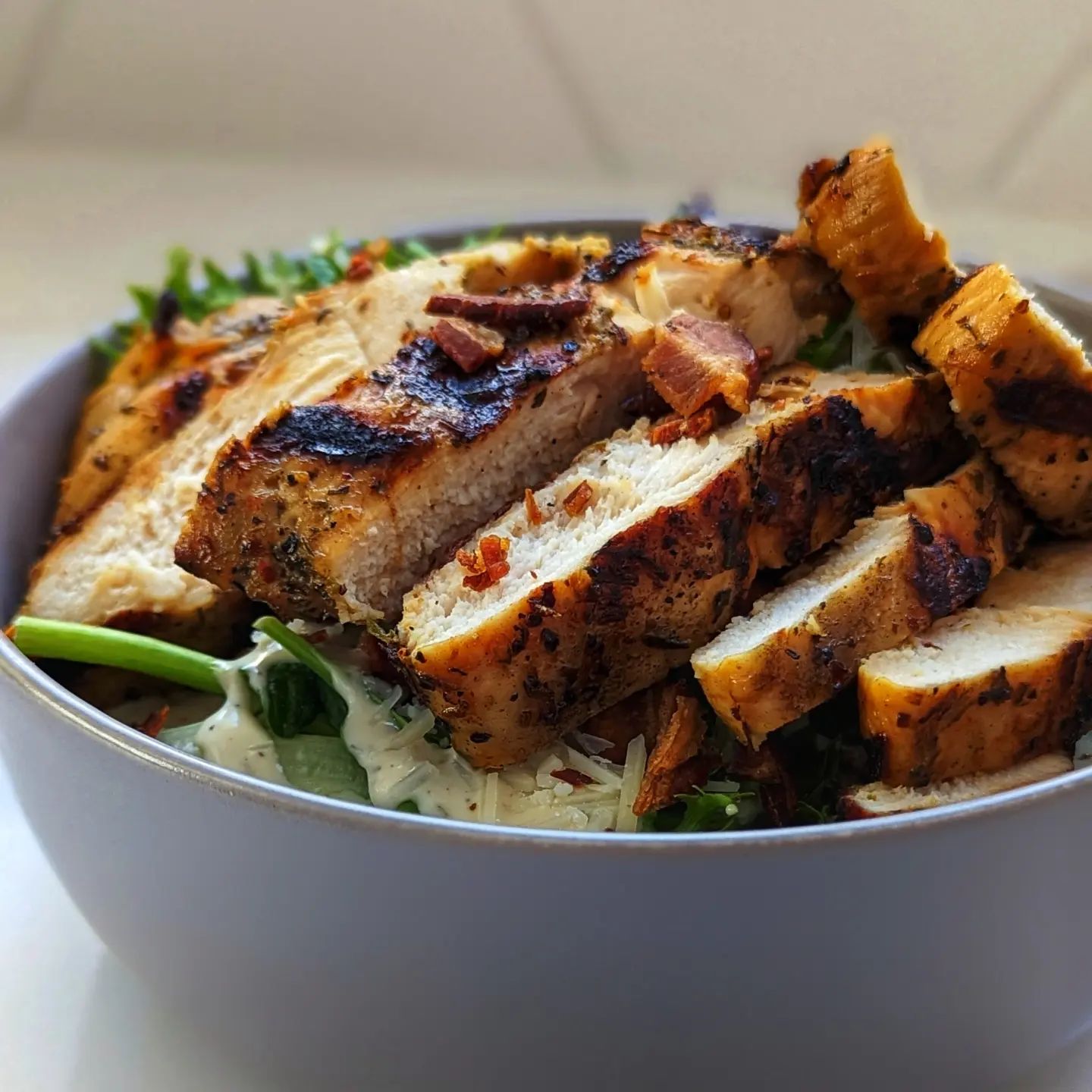 Simple salad with @brandingironranch grilled Italian herb chicken.Some fresh spring mix, ranch dressing and parmesan cheese make up the base, smoked bacon and the grilled chicken on top finish it up. Sometimes you just need an easy lunch to enjoy outside in the sun! The pre-seasoned and marinated chicken breast pairs perfectly with that @bearmountainbbq apple wood smoke. #salad #saladsofinstagram #lunch #easyrecipes #bearmountainbbq #grilledchicken #summerfood #eatoutside