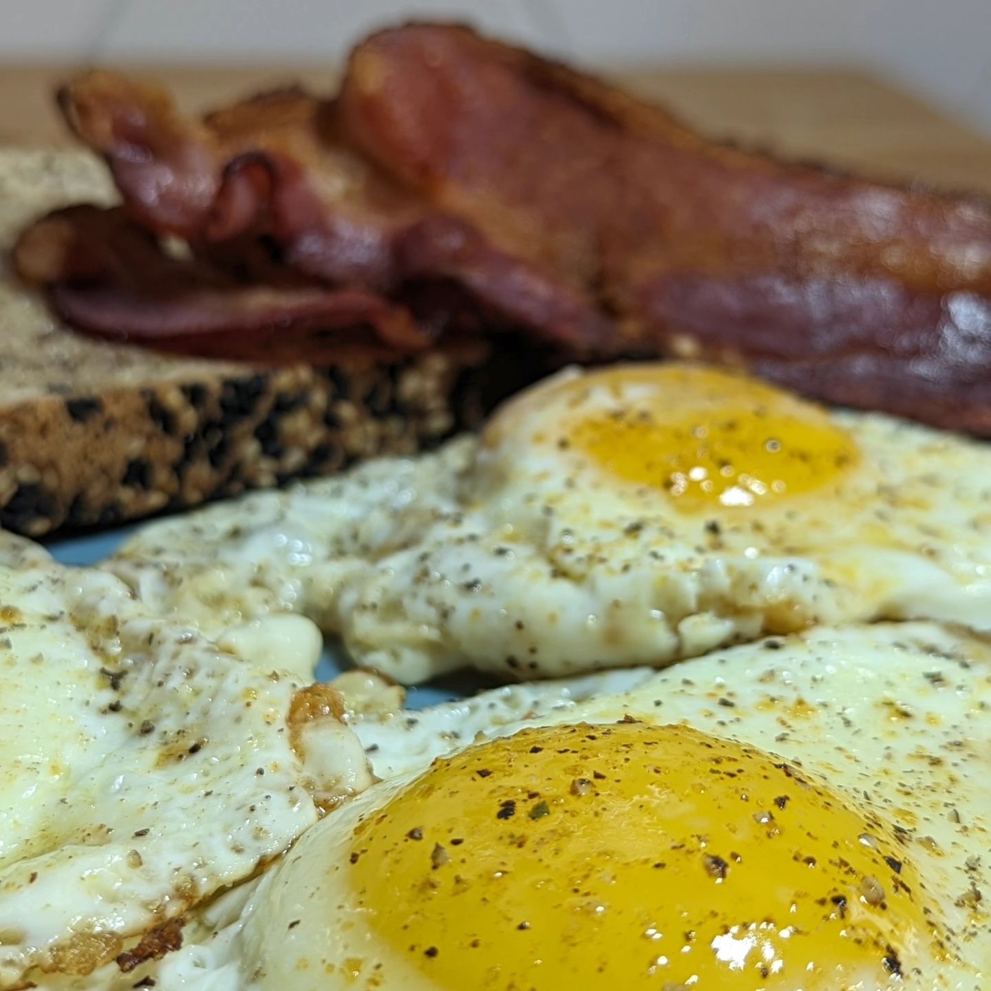 The classic breakfast3 eggs, 3 strips of crispy bacon and 2 slices of buttered toast.The eggs were cooked up in the bacon grease and seasoned simply with @redmondrealsalt garlic salt and fresh cracked pepper. The bacon was pan fried and is my @pepperexchange chipotle bacon (homemade, DM me for how) The toast is @carbonautbaking bread buttered with some unsalted butter. Protein packed, with enough substance to power you through the day! #breakfast #baconandeggs #eggsandbacon #classicbreakfast #americanbreakfast