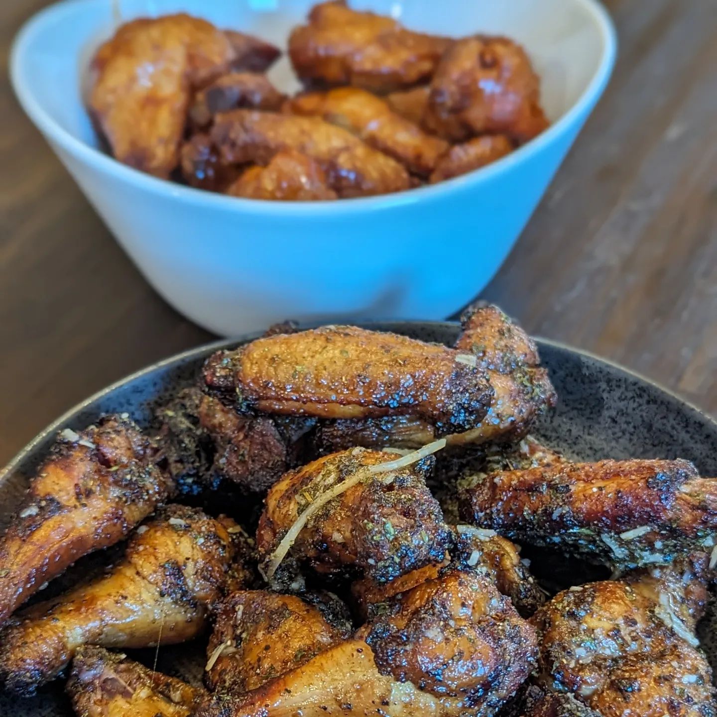 My Game Day Feast! The chicken wings were the star of the show. Two flavors, classic buffalo and a lemon pepper wing that was tossed in @spiceology chimichurri oil and parmesan. Both were smoked using @bearmountainbbq bourbon blend pellets at 225 till they were cooked internally, then I bumped the temp to 375 to crisp them up. The cheese sauce smoked alongside the wings, and was seasoned with @neilsarap southwest AP and @herdezbrand chipotle salsa. I made some chips for dipping as well, just a @cutdacarbCut into chips, lightly oiled and salted with @redmondrealsalt And baked at 375 till crispy. Some veggies and ranch dip, and Soft pretzels rounded it out for the snacks. #gameday #footballfood #chickenwings #queso #ranchdip #snacks #smokedwings #smokedqueso #chipsanddip