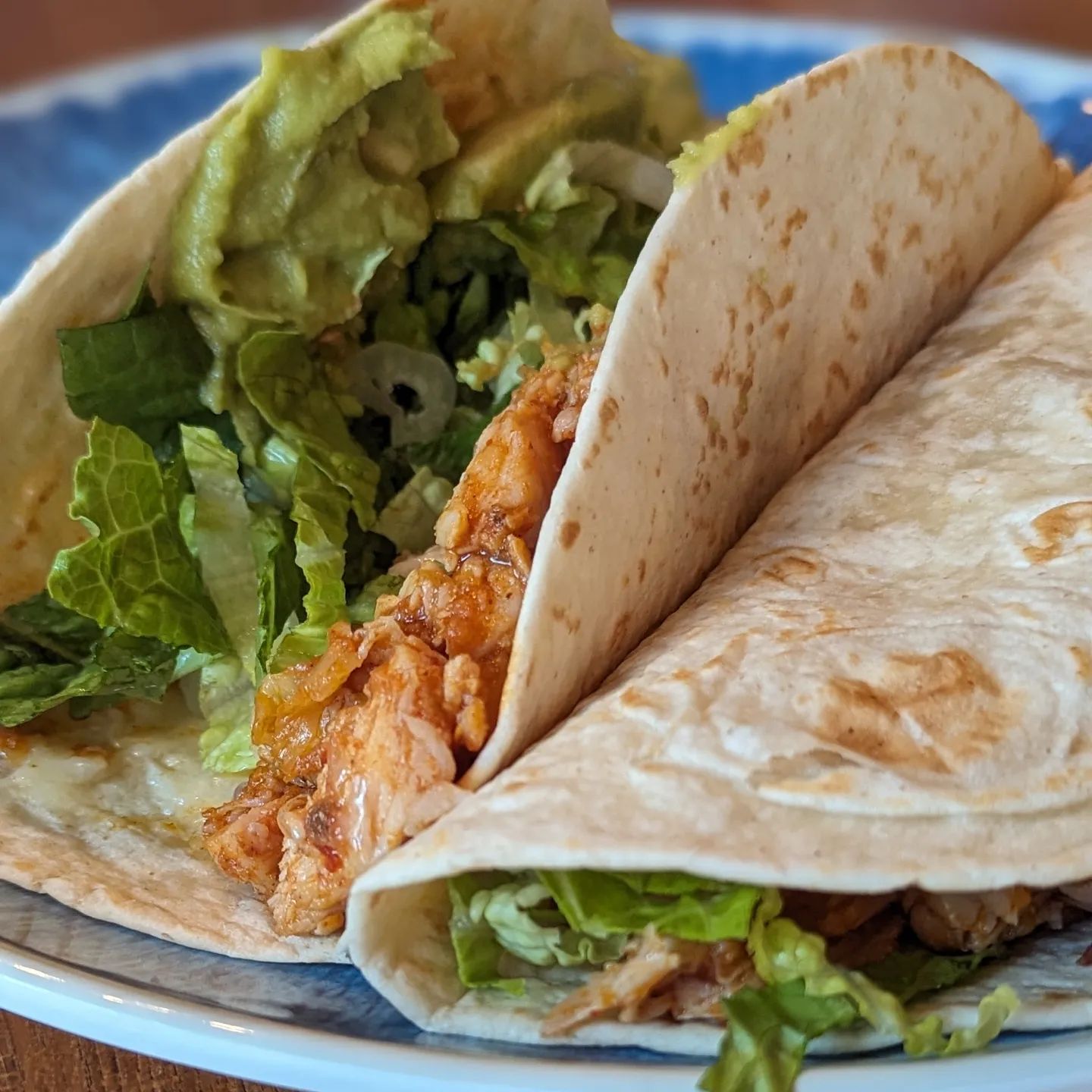 Shredded Chicken Tacos and some humorSwipe for the humor.These chicken tacos were delicious and so easy courtesy of the premade chicken. This was from Costco, ready to go sauce and all chipotle chicken. I admit, I did not follow the directions to boil in the bag and instead just tossed it into a skillet to warm. All wrapped up in @hero low carb tortillas, some @cabotcreamery cheddar cheese, a little shredded lettuce and a scoop of @eatwholly avocado is all I needed. The humor was on the drive home from the cabin, this trailer had a toy excavator fully strapped down on the otherwise empty trailer. My wife spotted it and it gave us both a laugh. #tacos #chickentacos #lowcarbtortilla #tacotuesday #taconight #moretacos #tacos🌮